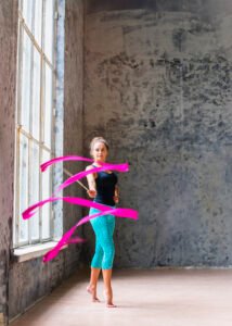 Woman exercising in gym using the best smart weighted hula hoop 2025 to tone her waist and improve core strength.